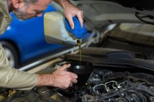 imgi_8_mechanic-pouring-oil-into-car-engine-1-scaled.jpg