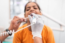 dentist-doing-the-treatment-of-a-female-patients-teeth-with-the-intraoral-camera-at-the-clinic...png